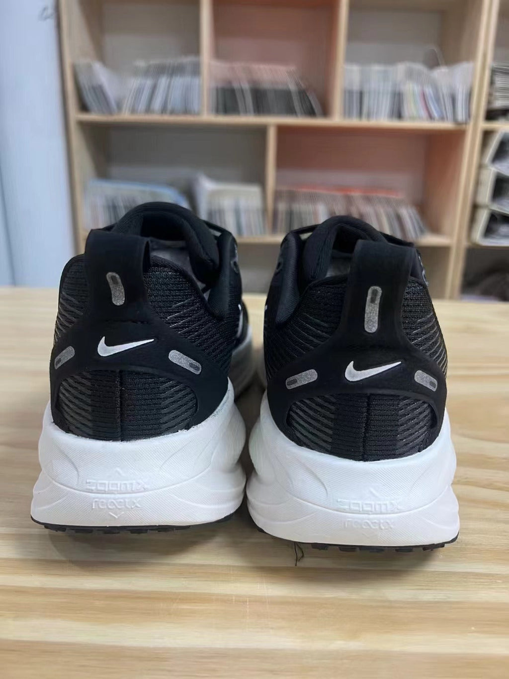Nike Vomero 18 Running Shoes in Black and White - product image from the listing.