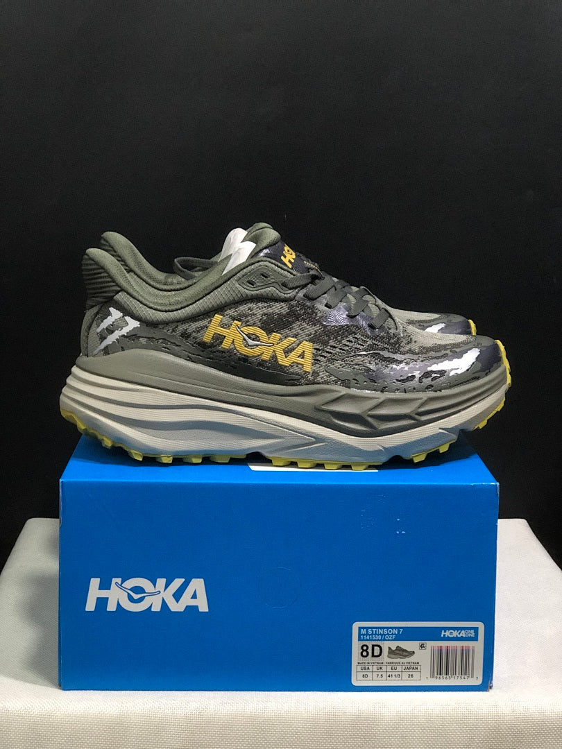 HOKA Stinson 7 Trail Running Shoes, in Gray and Yellow - product image from the listing.