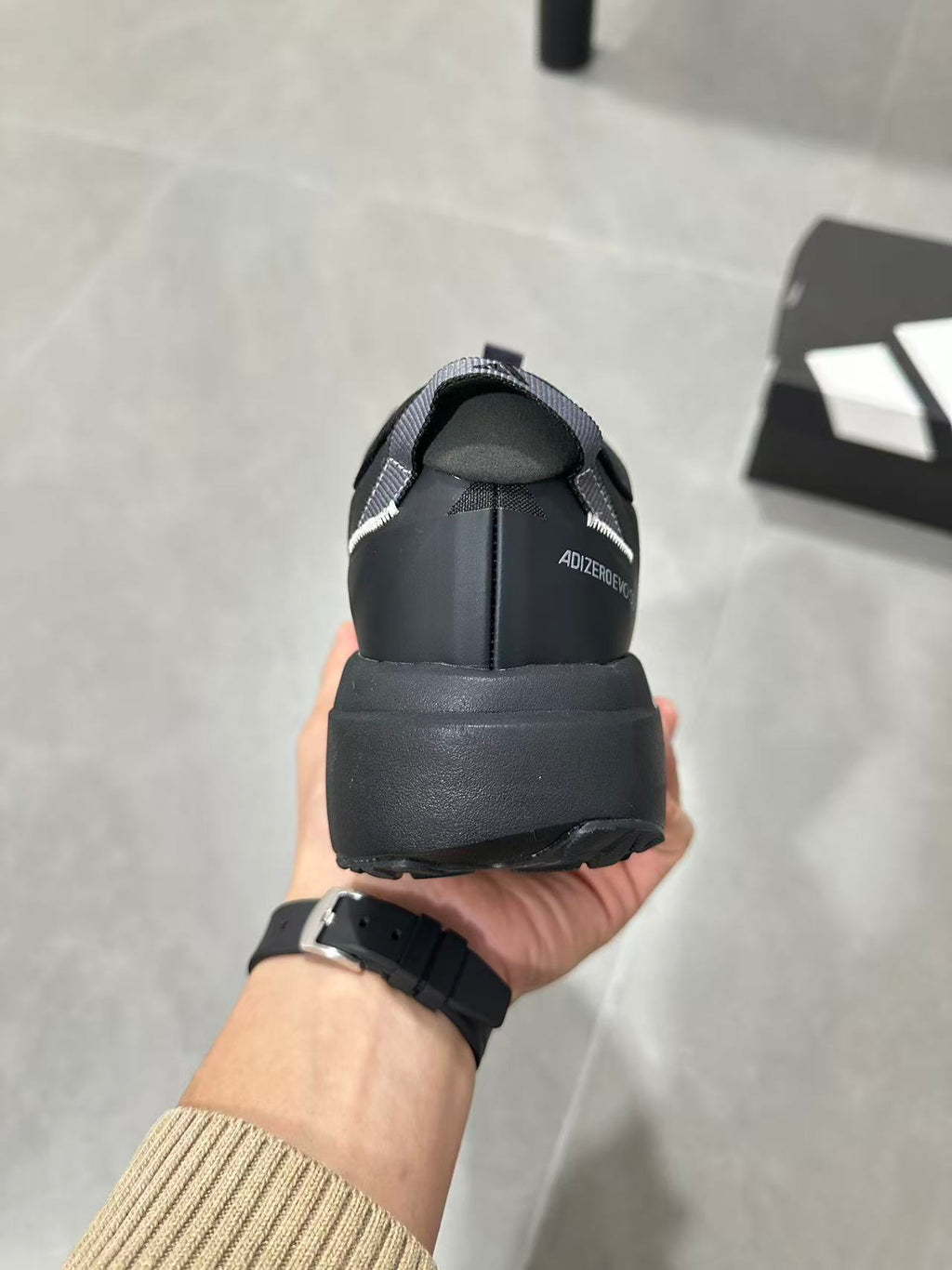 Adidas Lightstrike Pro Black Shoes for Running with White Stripes - product image from the listing.