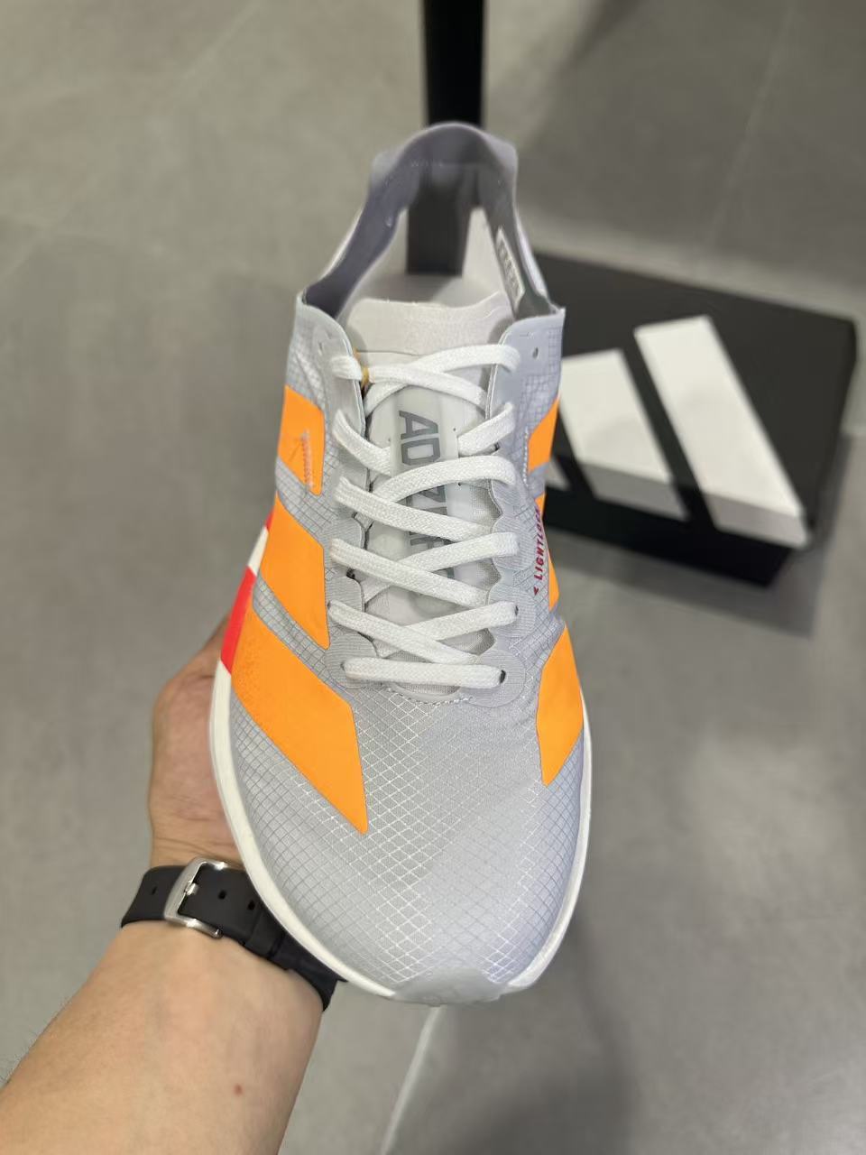 Adidas Adizero Lightstrike Pro Running Shoes in White Orange - product image from the listing.