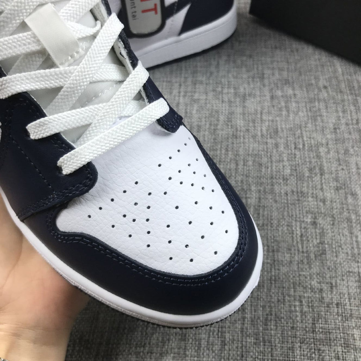 What The Obsidian Sneakers - Jordan 1 Mid 554724-174 - product image from the listing.