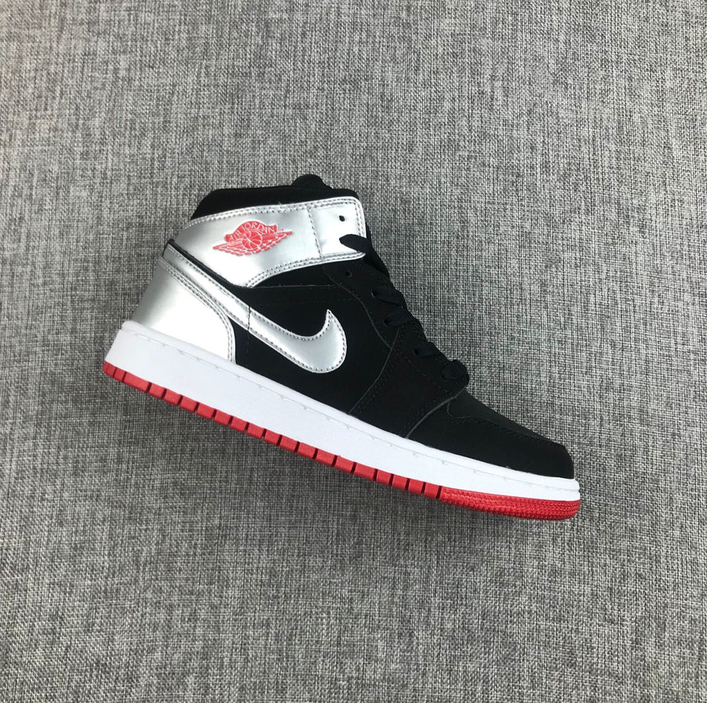 Air Jordan 1 Mid SE GS Sneakers in Black Silver 554725-057 - product image from the listing.
