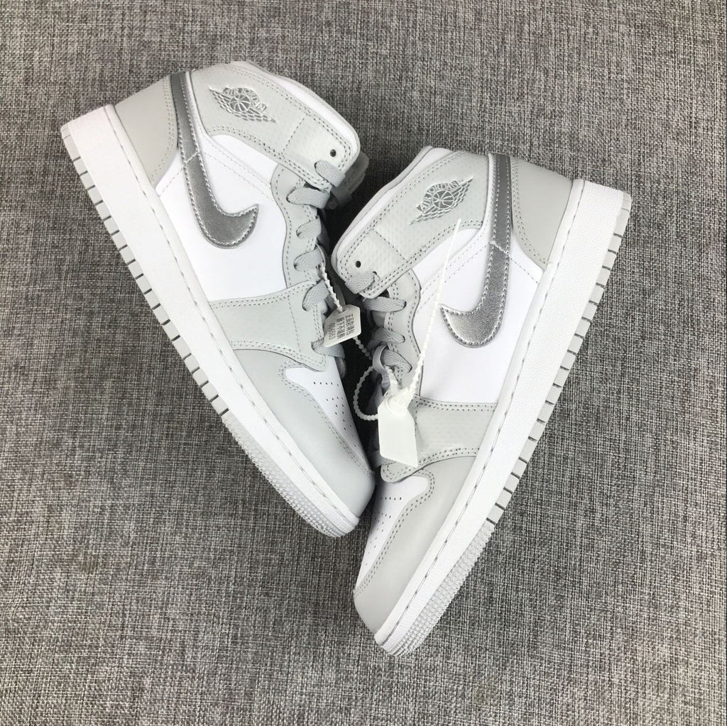 Air Jordan 1 Mid GS White and Silver Sneakers - product image from the listing.