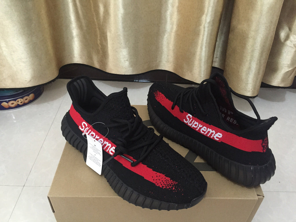 Yeezy 350 V2 Sneakers in Black and Red Knit - product image from the listing.