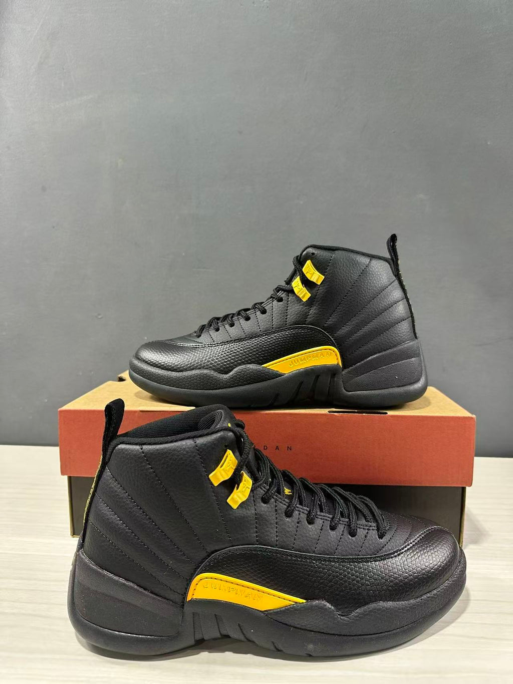 Air Jordan 12 Retro Black Taxi Sneakers CT8013-071 - product image from the listing.