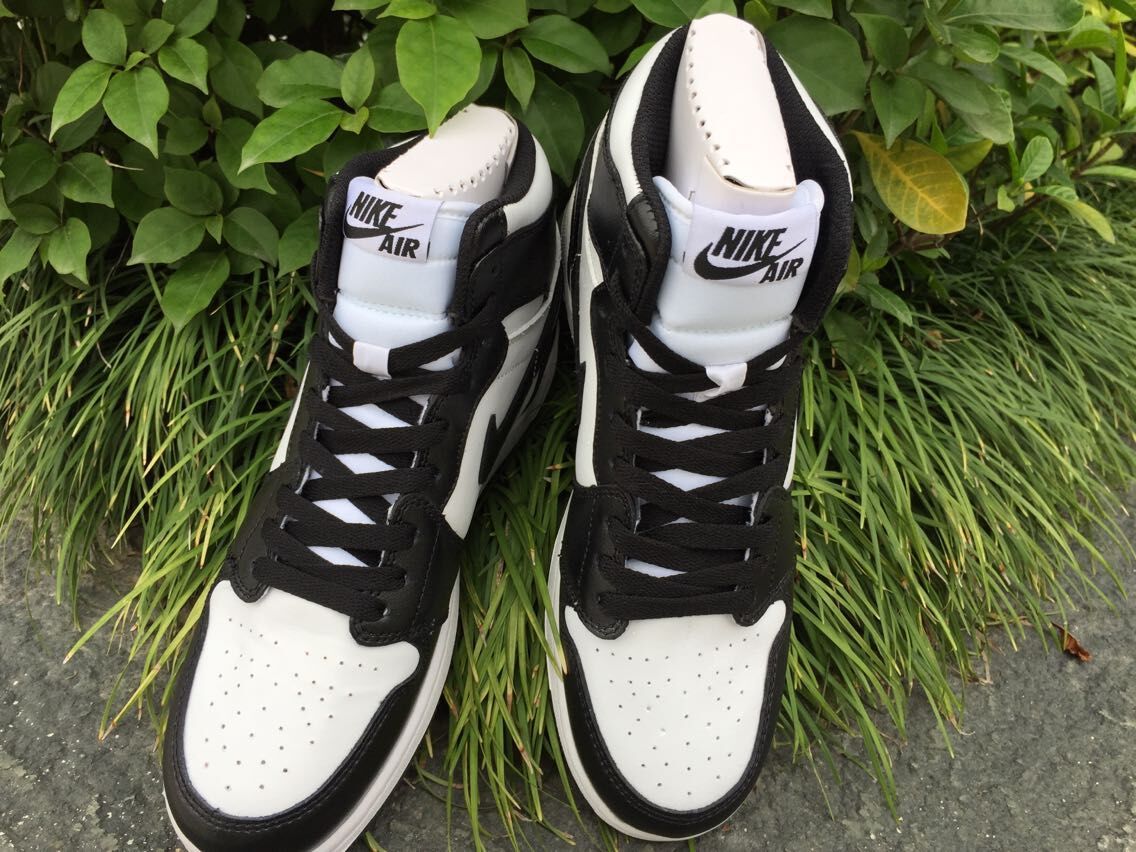 Women's Jordan 1 High Black and White Sneakers - product image from the listing.