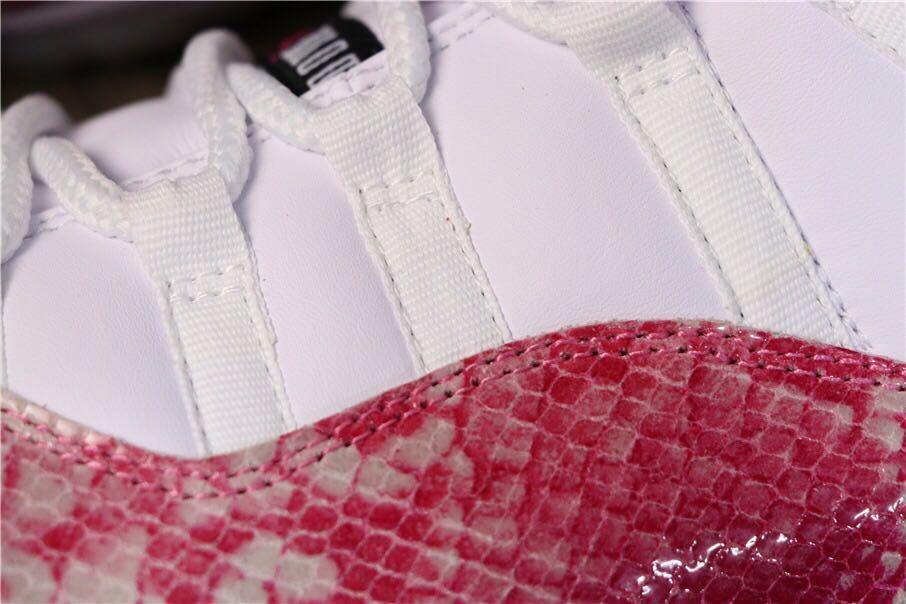 Women's Air Jordan 11 Retro Low Pink Snakeskin Sneakers - product image from the listing.