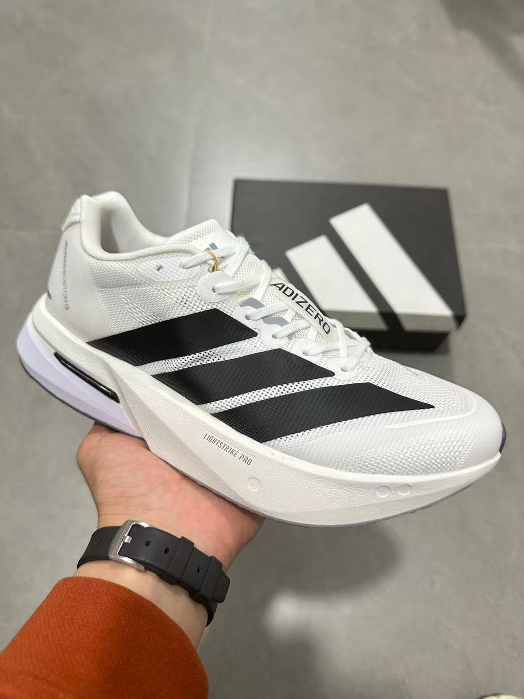 adidas Adizero Lightstrike Pro Running Shoes in White Black JS4939 - product image from the listing.