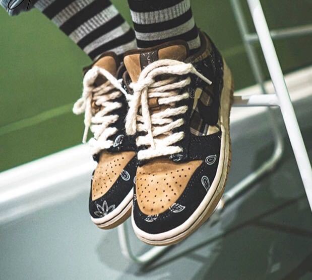 Black and Tan Jordan 1 High Paisley Pattern Sneakers - product image from the listing.