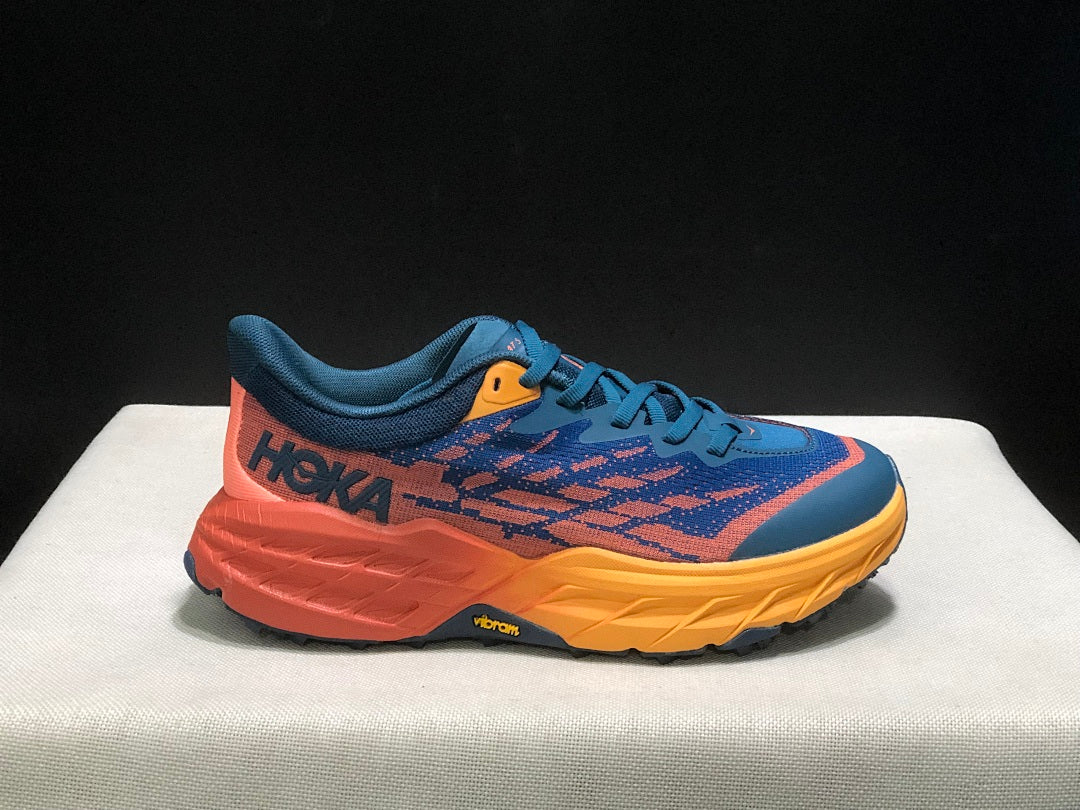 HOKA Speedgoat 5 Trail Running Shoes, in Blue and Orange - product image from the listing.