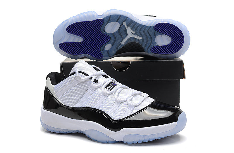 Air Jordan 11 Low Basketball Sneakers in White Black - product image from the listing.