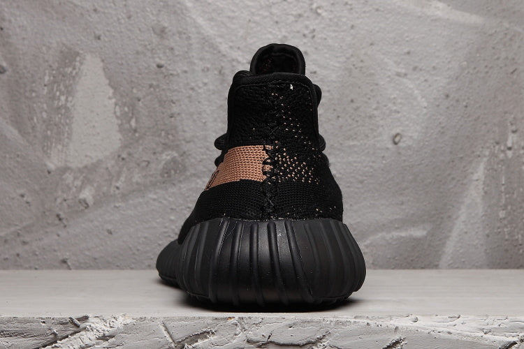 Yeezy Boost 350 V2 Sneakers in Black and Tan - product image from the listing.