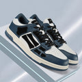 AMIRI Low-Top Sneakers in Navy, in White and Black - product image from the listing.