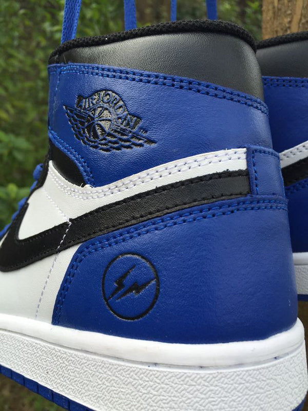 Jordan 1 High Sneakers in Black, in White and Royal Blue - product image from the listing.
