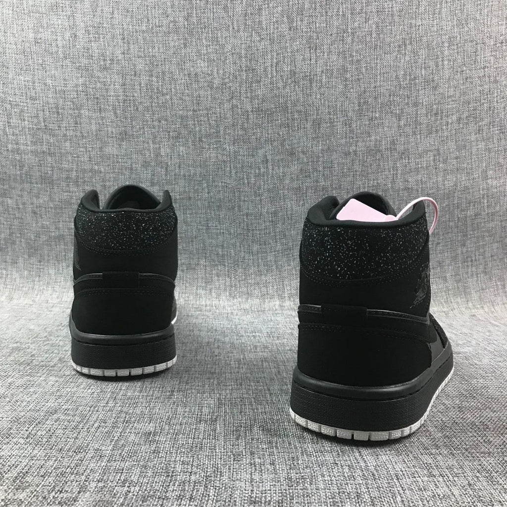 Air Jordan 1 Mid Black and White Sneakers 554724-001 - product image from the listing.