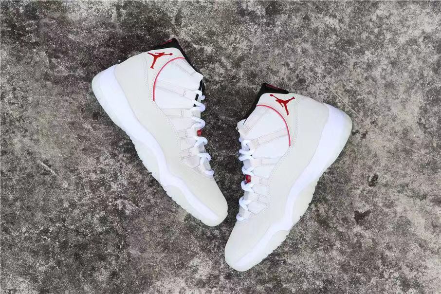 Air Jordan 11 Platinum Tint White High-Top Sneakers - product image from the listing.