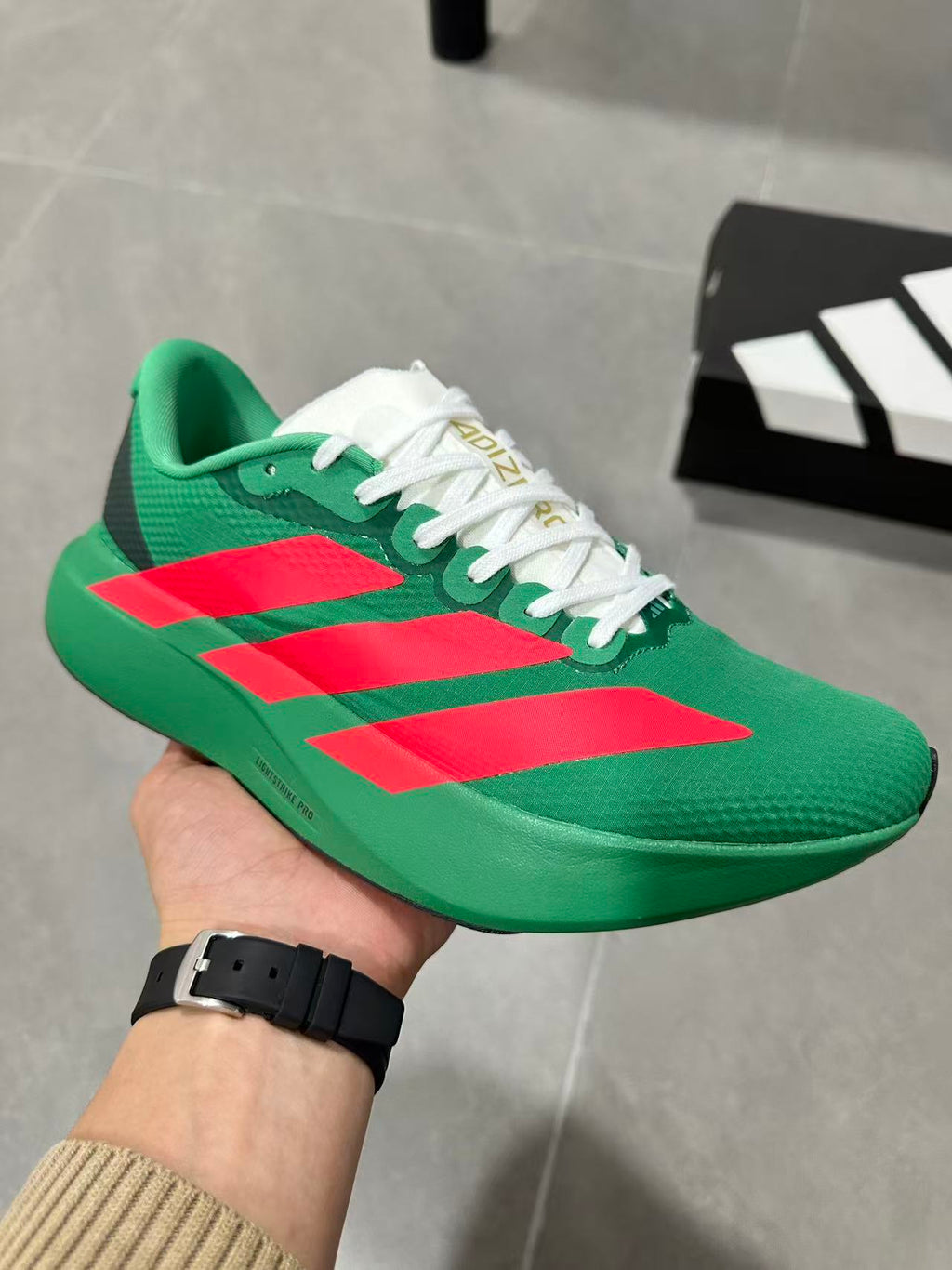 Adidas Lightstrike Pro Running Shoes in Green Red JQ4440 - product image from the listing.
