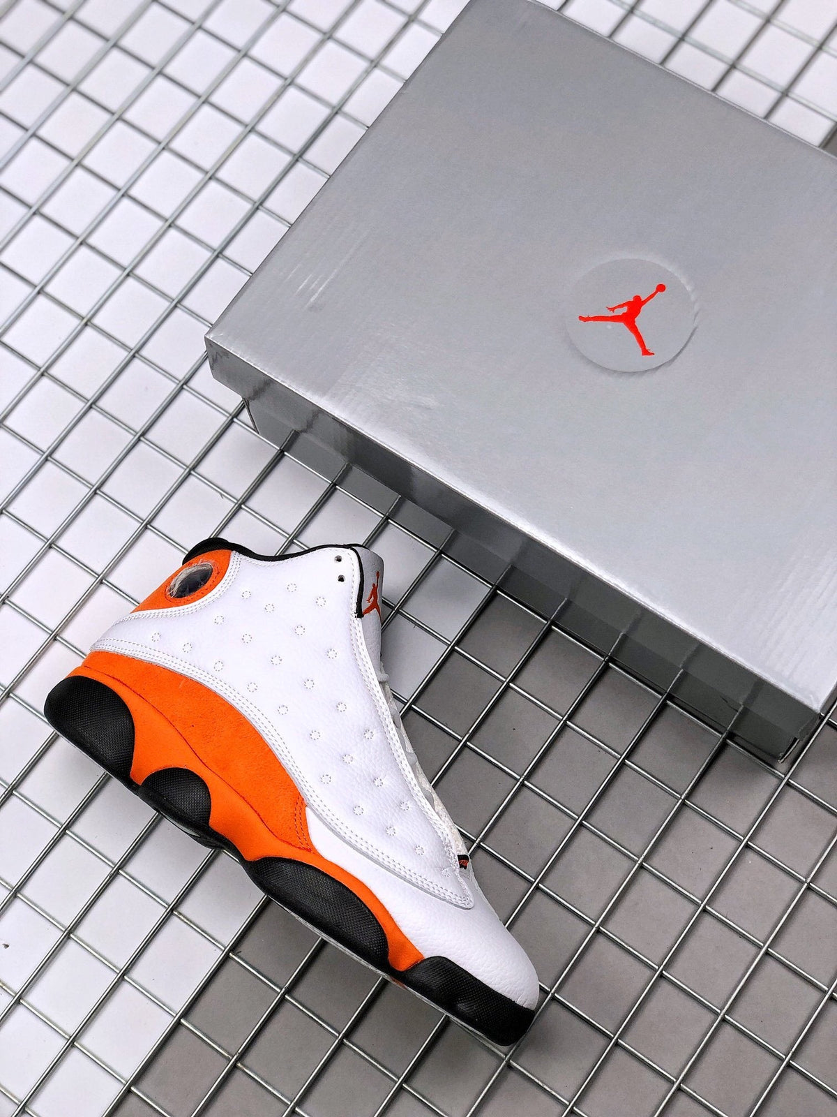 Air Jordan 13 Starfish White Orange Sneakers 414571-108 - product image from the listing.