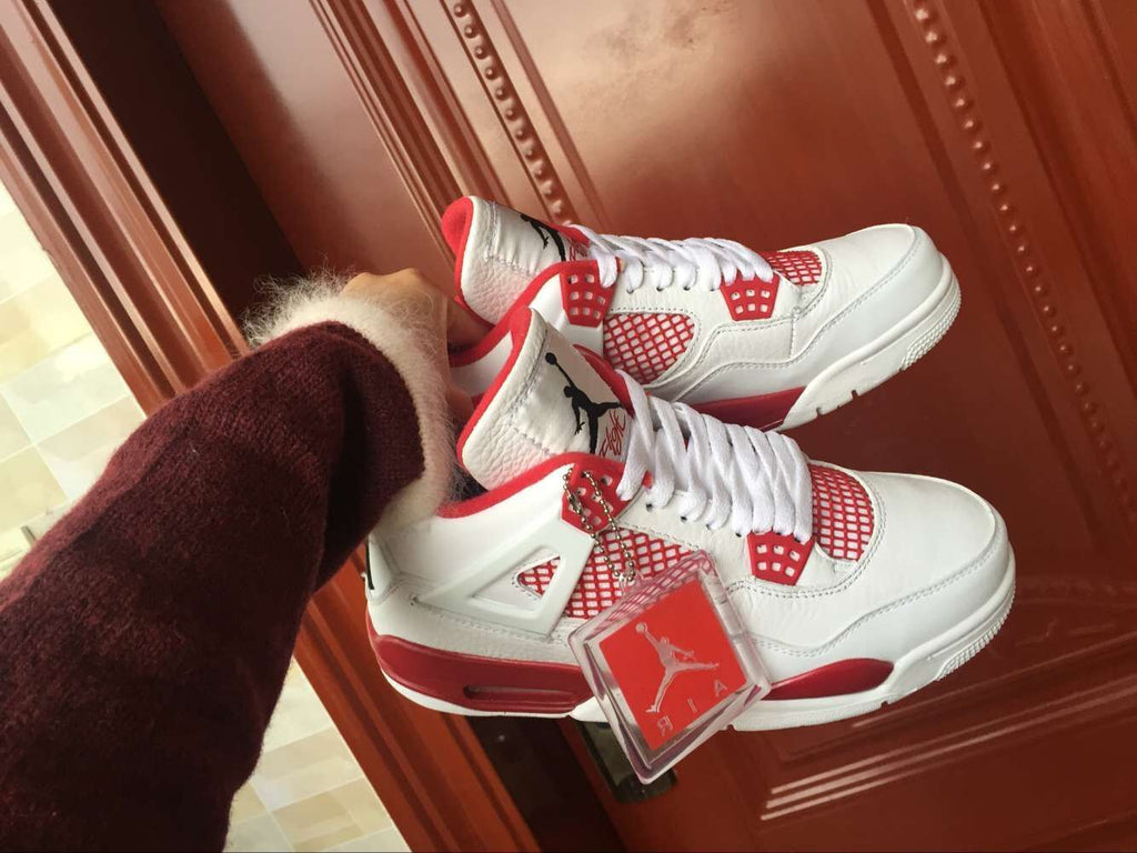 Jordan 4 Retro High-Top Sneakers in White and Red - product image from the listing.