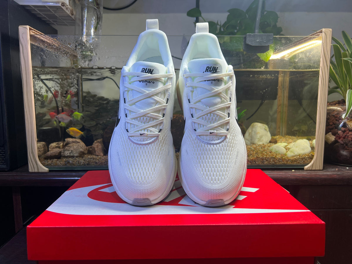 Nike Vomero 18 Running Shoes in Blue and White - product image from the listing.