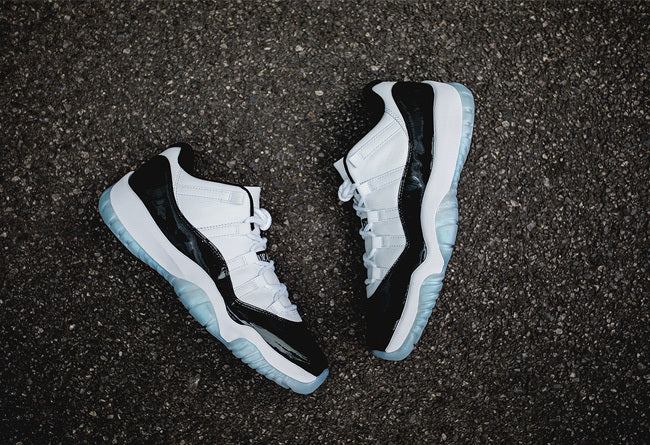 White and Black Air Jordan 11 Iridescent Sneakers - product image from the listing.