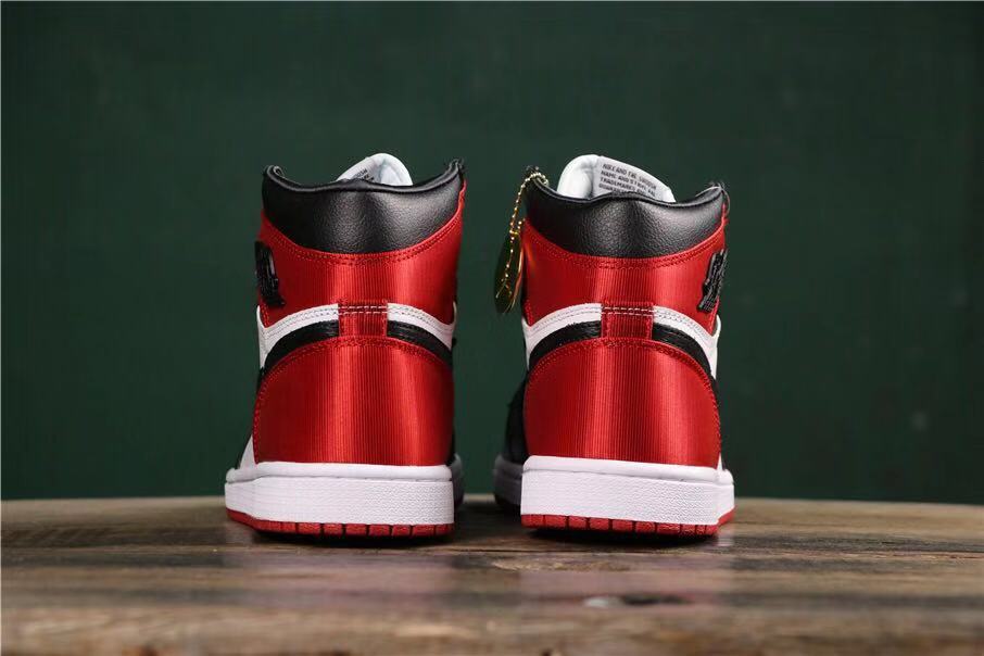 Air Jordan 1 Satin Black Toe High-Cut Sneakers - product image from the listing.
