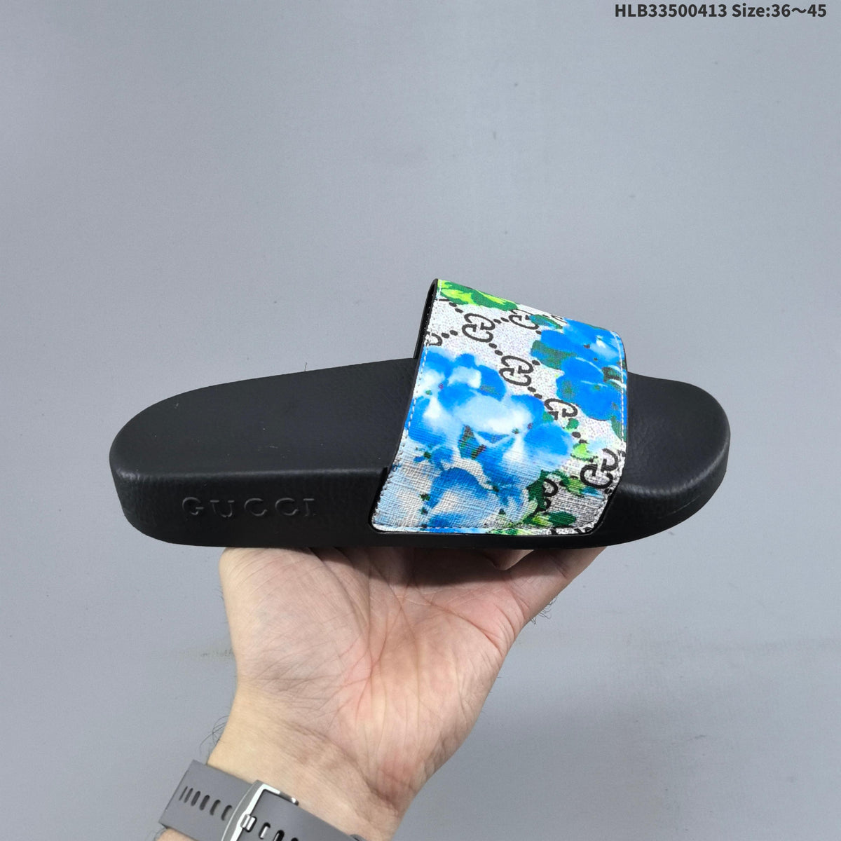 Floral Print Slide Sandals with Black Footbed by Gucci - product image from the listing.