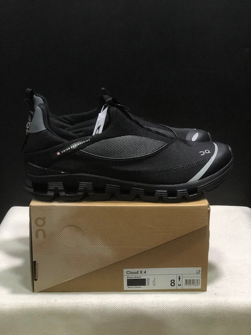 On Cloud 4 Coast Black Slip-On Trainers - product image from the listing.