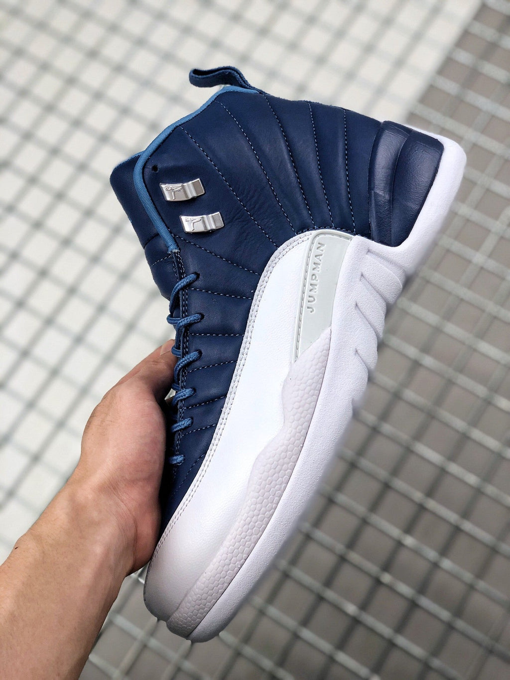 Air Jordan 12 Indigo Sneakers 130690-404 - product image from the listing.