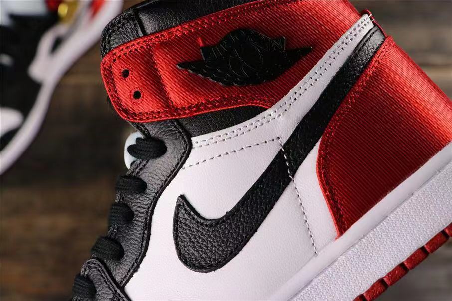 Air Jordan 1 Satin Black Toe High-Cut Sneakers - product image from the listing.