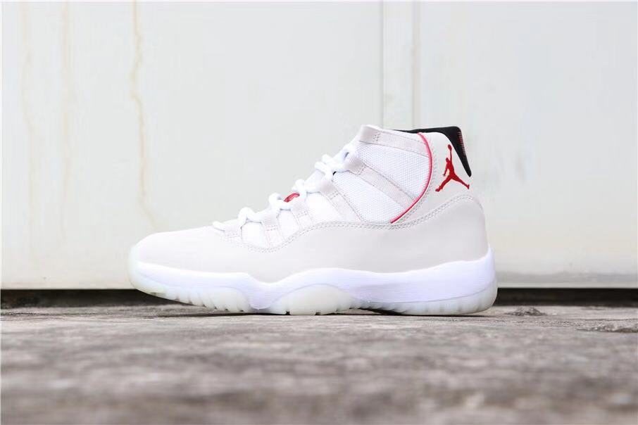 Air Jordan 11 Platinum Tint White High-Top Sneakers - product image from the listing.