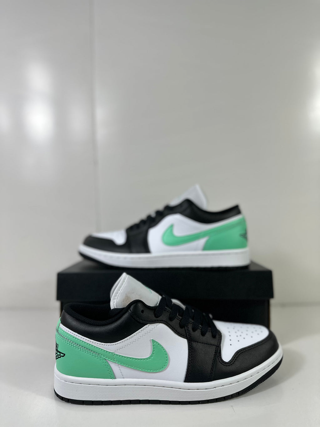 Air Jordan 1 Low White Green Black Sneakers 553558-131 - product image from the listing.