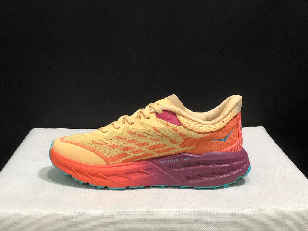 Yellow and Coral HOKA Speedgoat 5 Trail Running Shoes - product image from the listing.