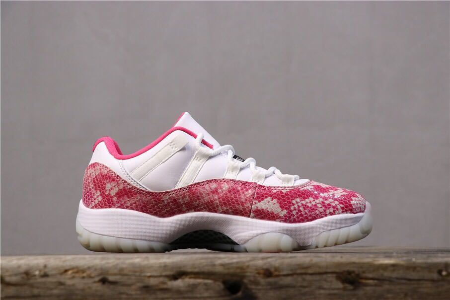 Women's Air Jordan 11 Retro Low Pink Snakeskin Sneakers - product image from the listing.