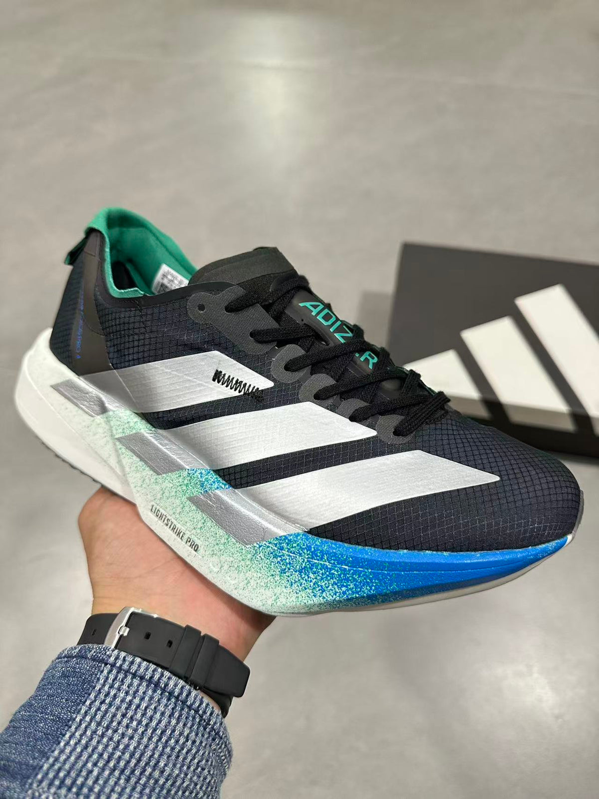 Nike Adizero Lightstrike Pro Running Shoes in Black Blue - product image from the listing.