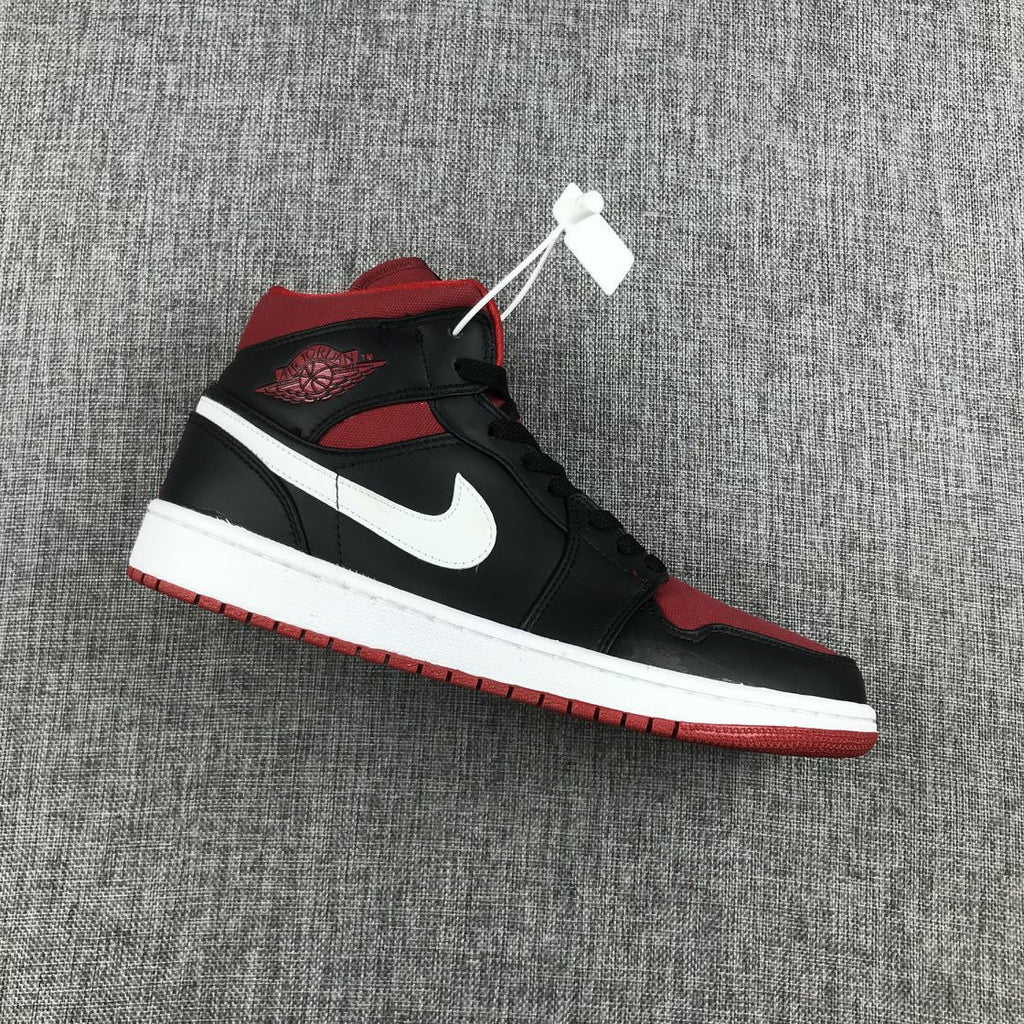 Black Red Canvas-Style Sneakers - Jordan 1 Mid 554724-020 - product image from the listing.