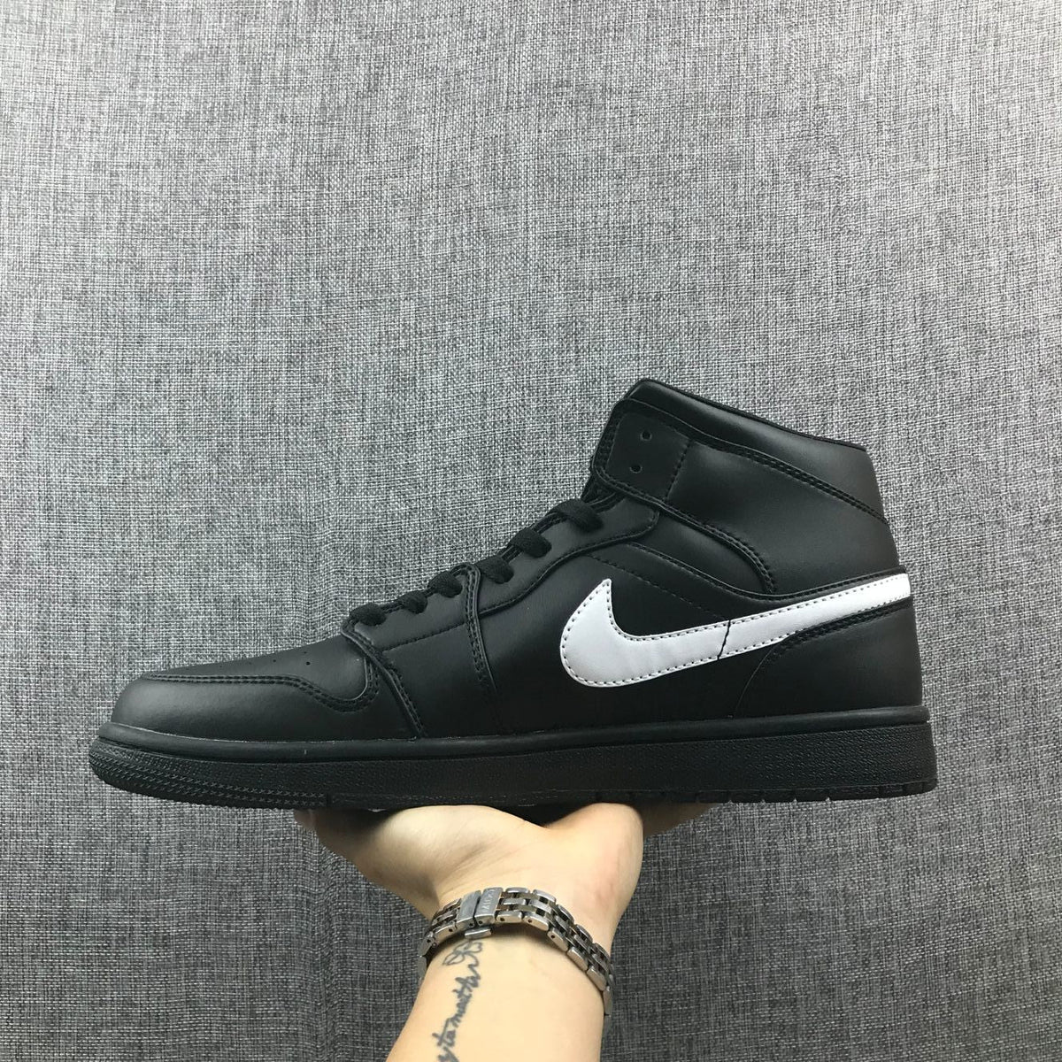 Air Jordan 1 Mid Sneakers in Black White 554724-049 - product image from the listing.