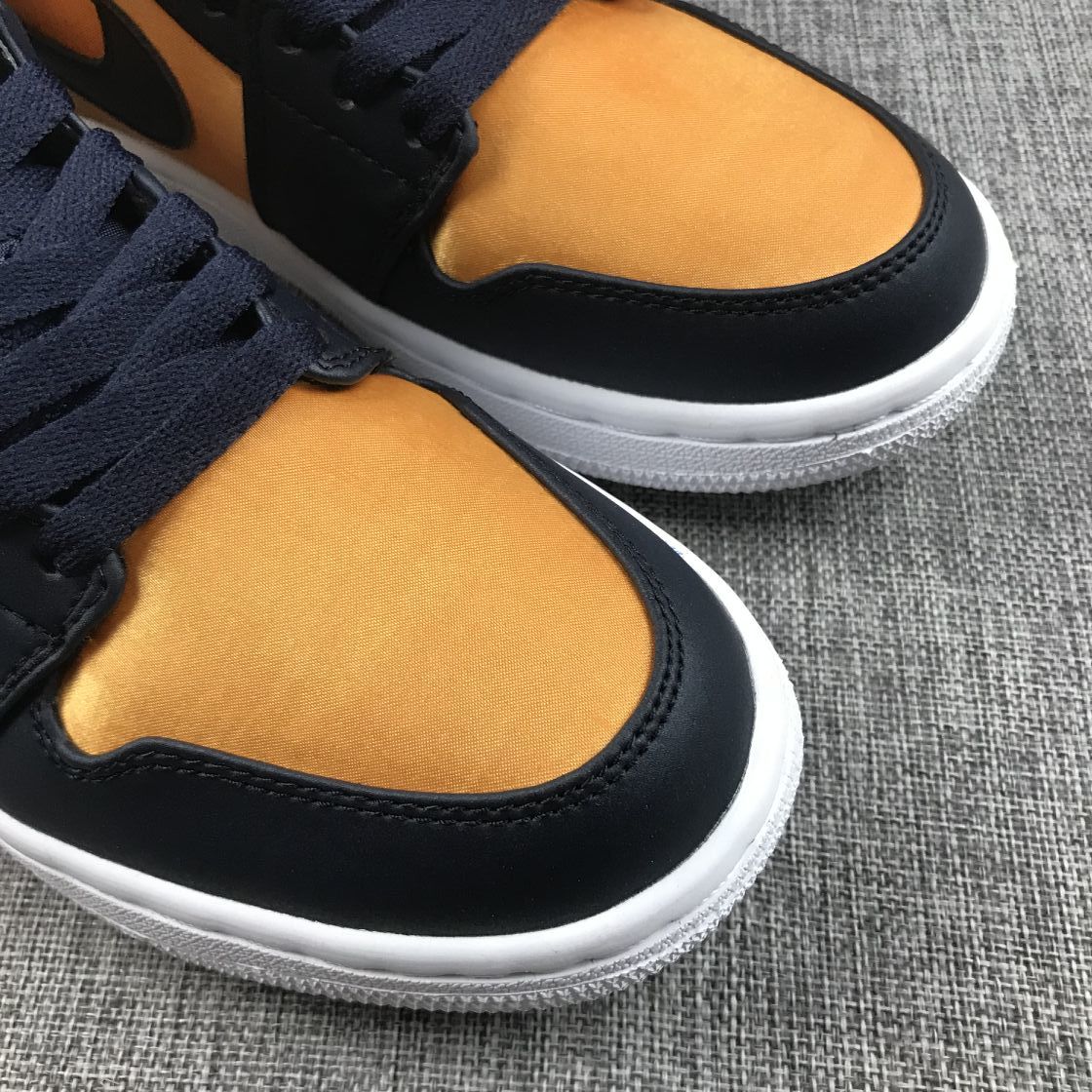 Air Jordan 1 Mid SE Sneakers in Black and Gold 852542-401 - product image from the listing.