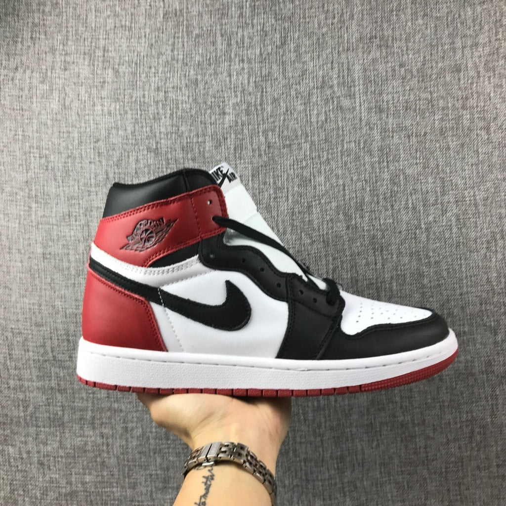 Black Toe Sneakers - Air Jordan 1 High 555088-184 - product image from the listing.
