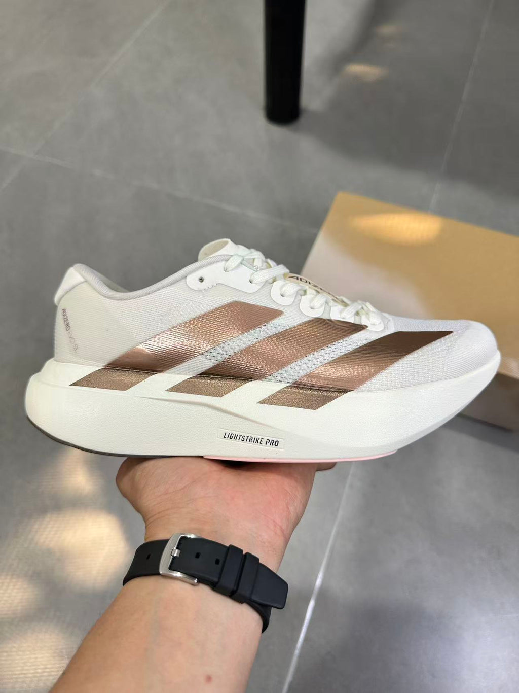Adidas Adizero Lightstrike Pro White Champagne Shoes for Running - product image from the listing.
