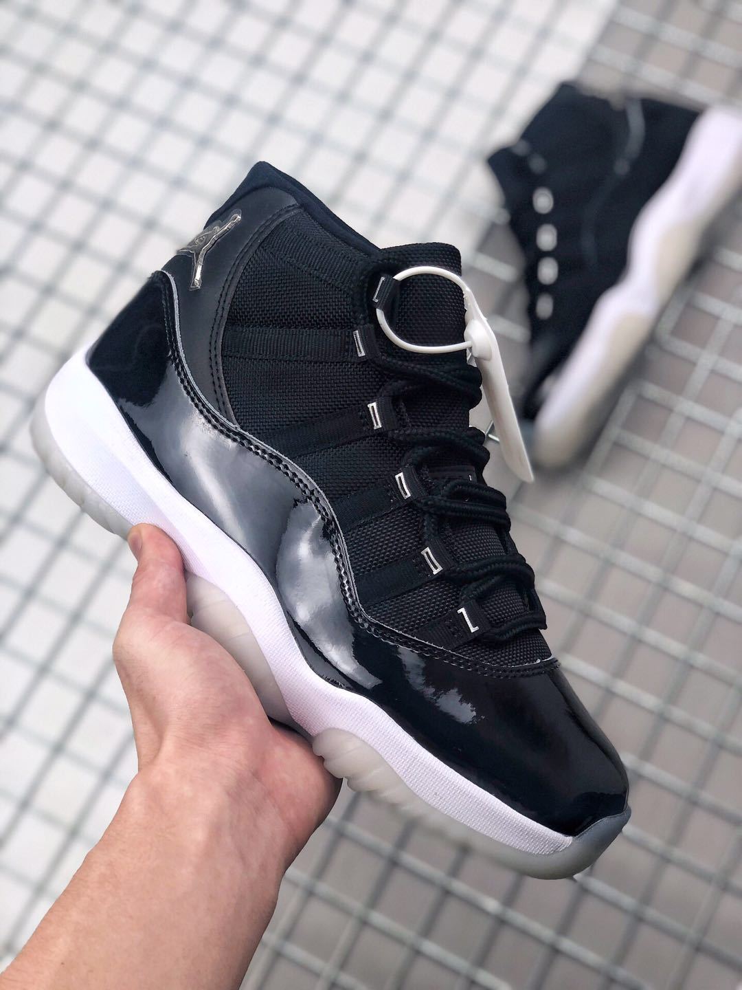 Air Jordan 11 Silver Eyelets Black White Sneakers - product image from the listing.