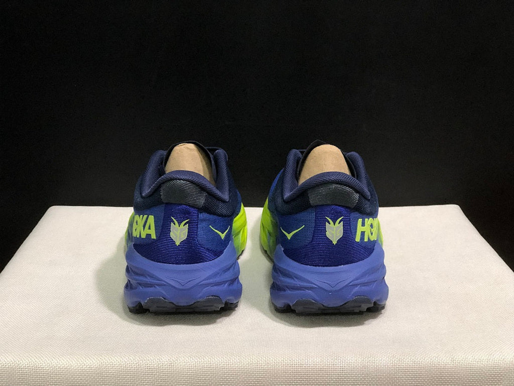 HOKA Speedgoat 5 Trail Running Shoes, in Navy and Lime - product image from the listing.