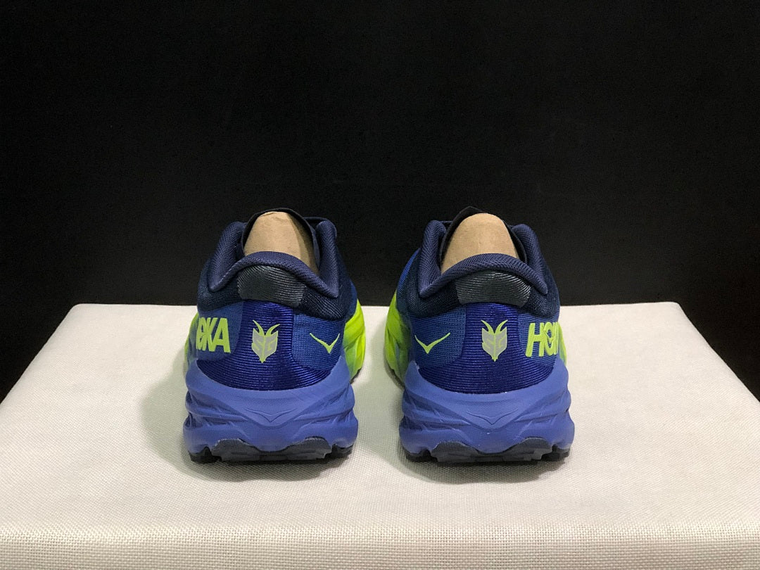HOKA Speedgoat 5 Trail Running Shoes, in Navy and Lime - product image from the listing.