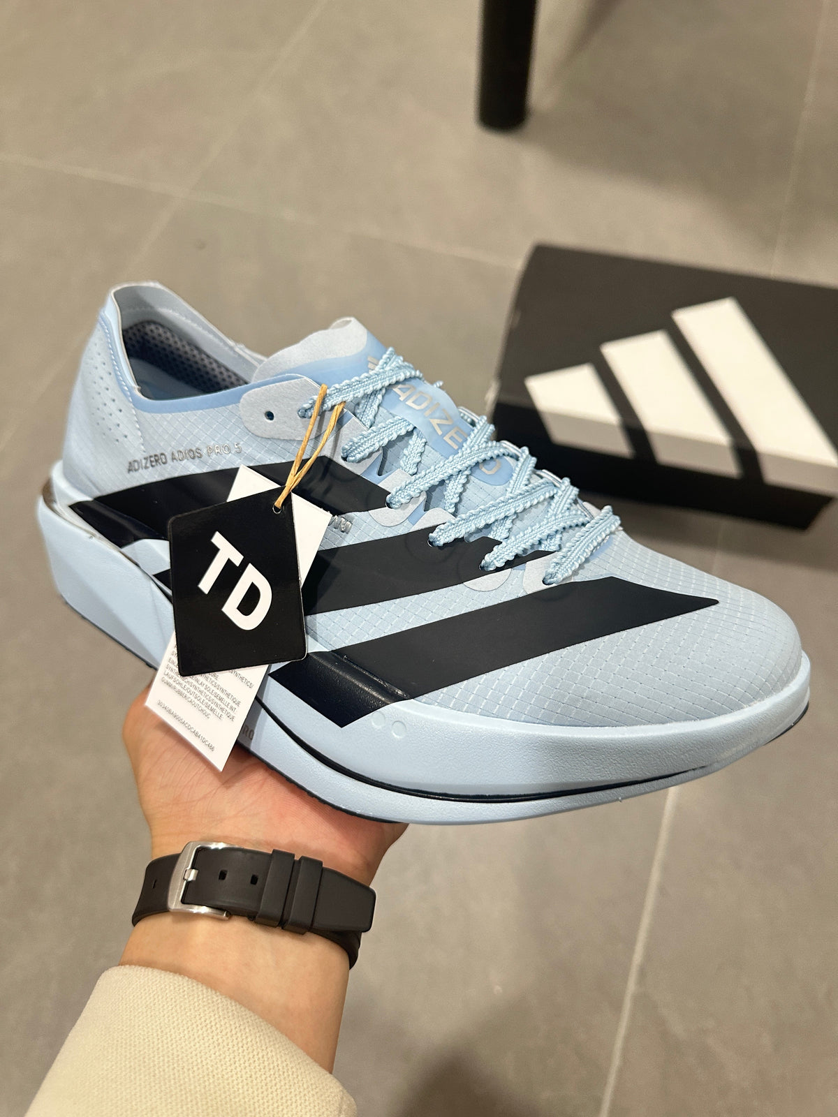 adidas Adizero Adios Pro Running Shoes, in Light Blue and Black - product image from the listing.