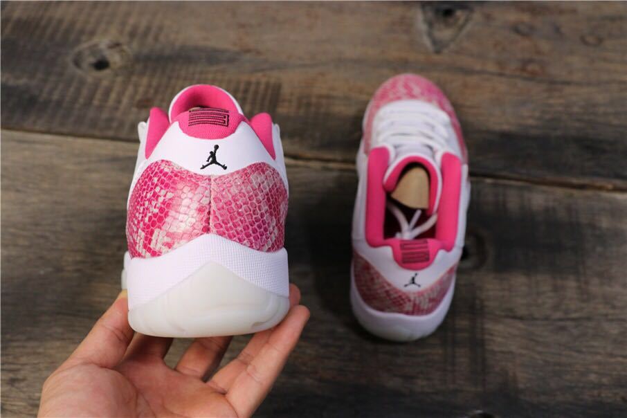 Women's Air Jordan 11 Retro Low Pink Snakeskin Sneakers - product image from the listing.