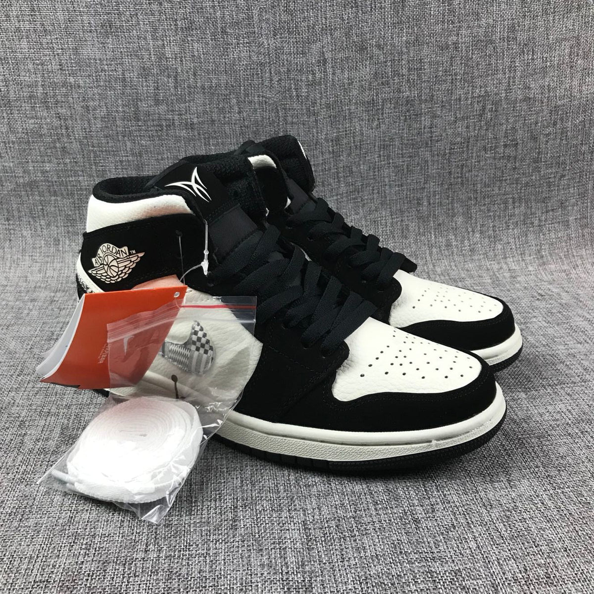 Black History Month Sneakers - Air Jordan 1 Mid 852542-010 - product image from the listing.