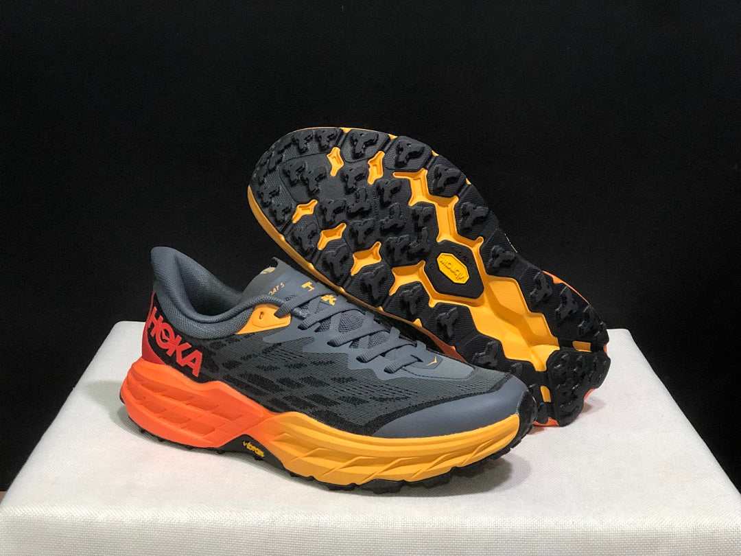 HOKA Speedgoat 5 Trail Running Shoes, in Gray and Orange - product image from the listing.