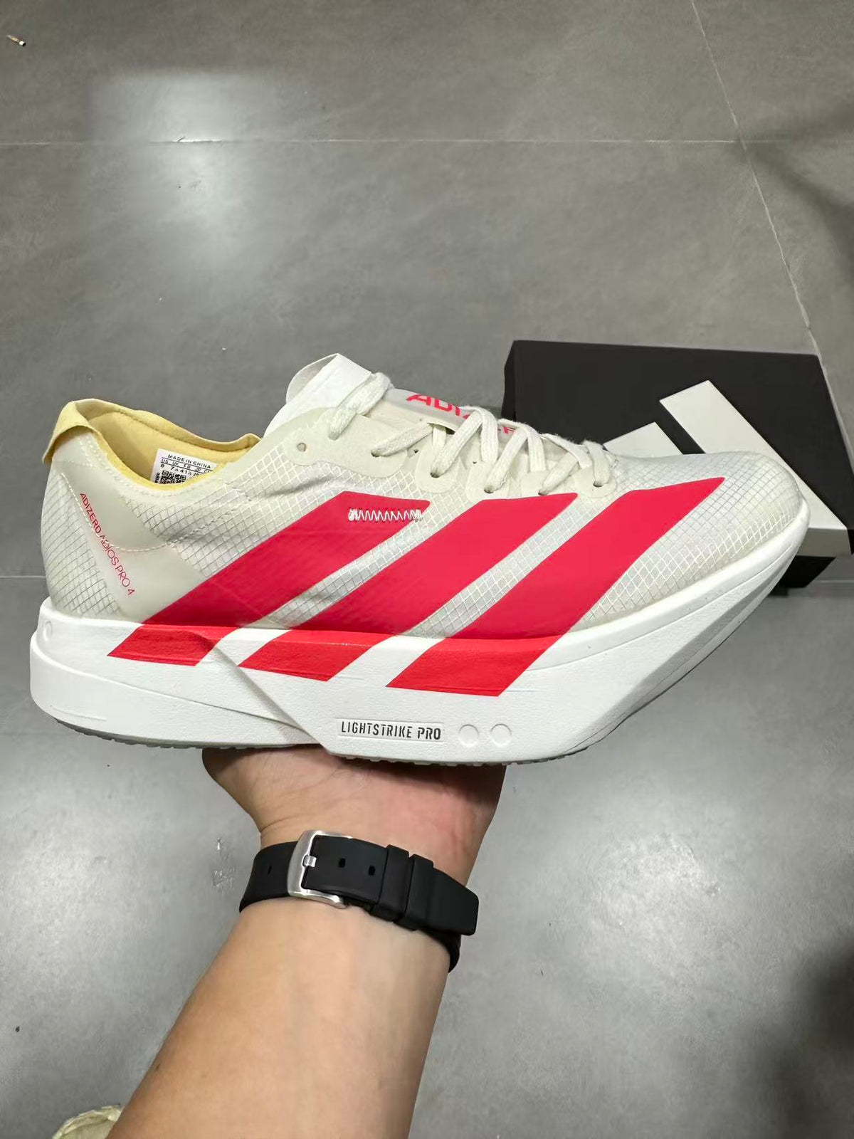 adidas Lightstrike Pro Running Shoes in White Red JR4542 - product image from the listing.