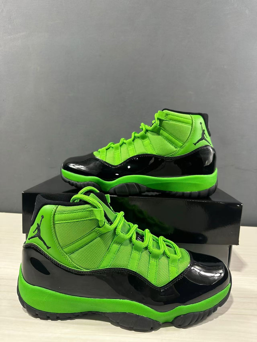 Air Jordan 11 Retro Sneakers in Black Green CT8012-310 - product image from the listing.