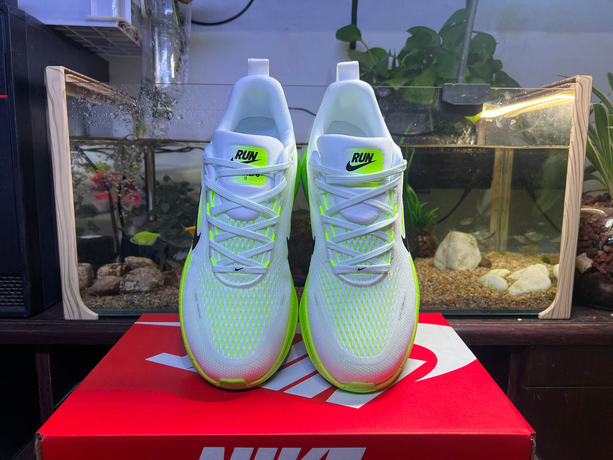 Blue and Volt Green Nike Vomero 18 Running Shoes - product image from the listing.
